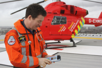 Medical emergency helicopter and pilot next to it